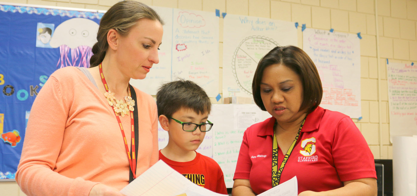 System of Great Schools Teachers with a student
